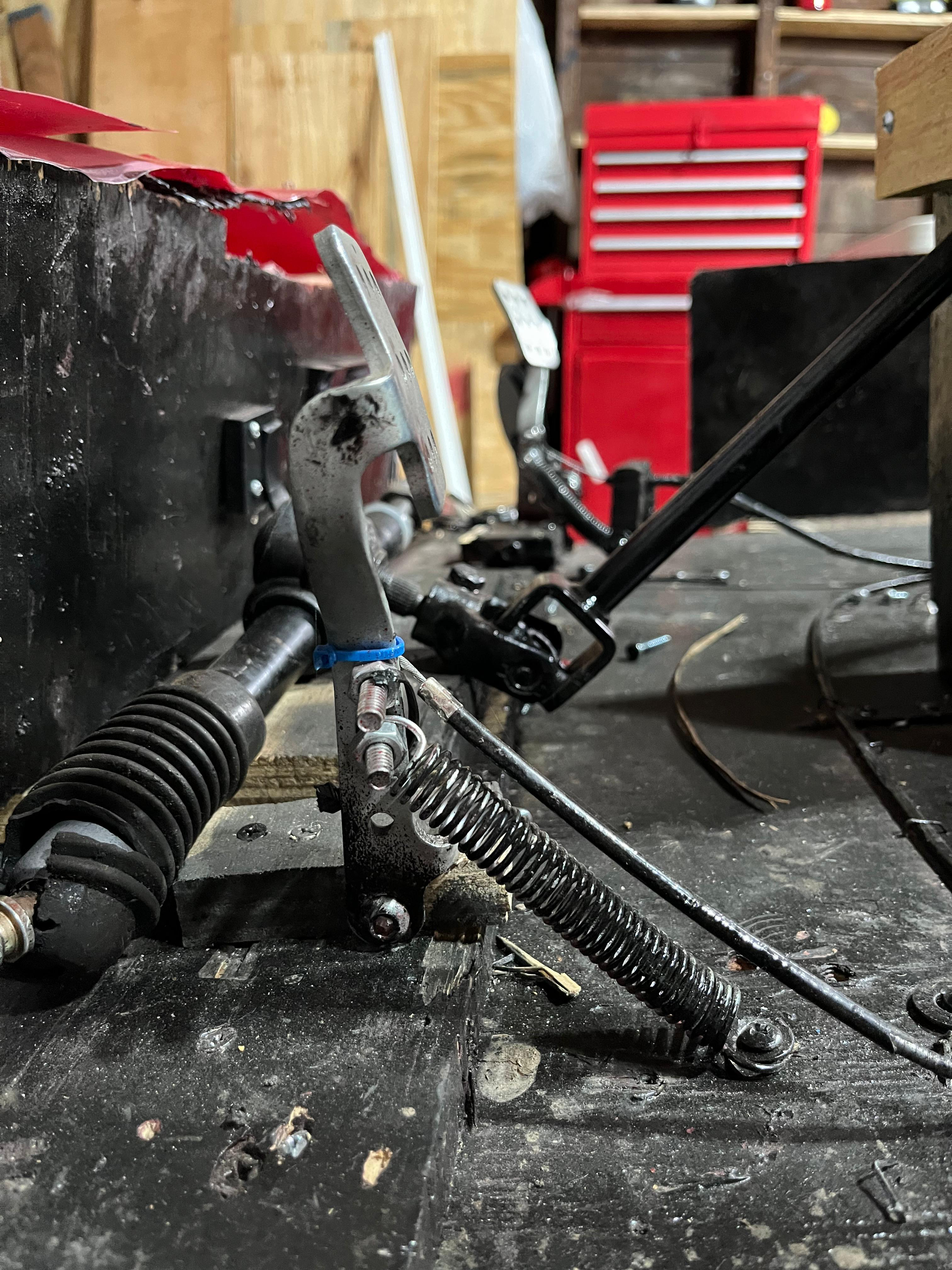 Brake pedal mechanism and cable routing